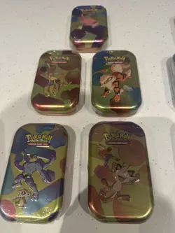 Pokemon TCG - Scarlet & Violet 151/Prismatic Evolutions- 10x MINI TIN - Image 1
