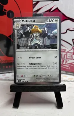 Pokemon TCG Stellar Crown Melmetal 104/142 Cosmos Holo Blister Exclusive - Image 1