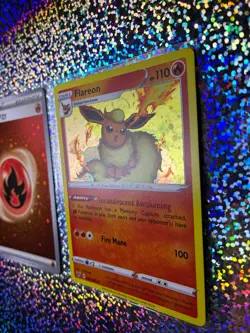2020 Pokemon TCG Vivid Voltage Cosmos Holo 026/185 Flareon (With a Holo Swirl) - Image 3