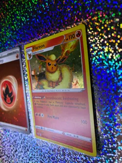 2020 Pokemon TCG Vivid Voltage Cosmos Holo 026/185 Flareon (With a Holo Swirl) - Image 4