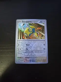 Pokemon Prismatic Evolutions Dunsparce 079/131 Reverse Holo NM - Image 1
