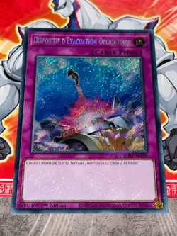 Carte Yu Gi Oh DISPOSITIF D'EVACUATION OBLIGATOIRE RA01-FR069 SECRET RARE - Image 1