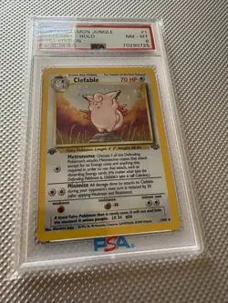 1999 Pokemon TCG Jungle Clefable Holo 1st Edition PSA 8 1/64 Card Stock - Image 1