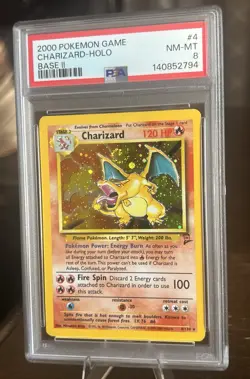 2000 Pokemon Base Set 2 Charizard Holo PSA 8 With Very Rare Holo Swirl - Image 1