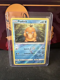 Psyduck 40/236 Cosmic Eclipse Sun & Moon Reverse Holo Pokemon TCG - Image 1