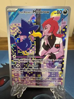 Team Rocket’s Murkrow 200/182 Illustration Rare Pokemon Card SV TCG Holo NM - Image 1