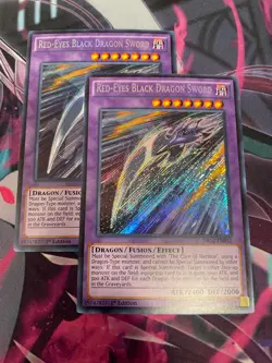 YUGIOH - RED EYES BLACK DRAGON SWORD X2 - SECRET RARE - 1ST ED - NM - DRL2 - Image 1