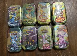 Pokemon Prismatic Evolutions Complete Set of 8 Mini Tins SEALED - Image 1