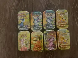 Pokemon Prismatic Evolutions Complete Set of 8 Mini Tins SEALED - Image 1