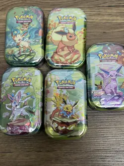 Pokemon Set of 5 S&V Prismatic Evolutions Mini Tins. Brand New Sealed. - Image 1