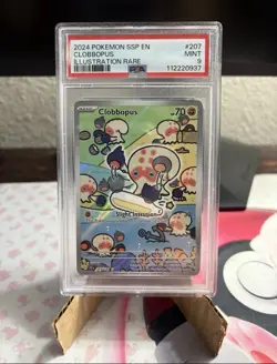 Pokemon TCG Clobbopus 207/191 Surging Sparks Illustration Full Art PSA 9 - Image 1