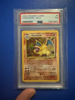 1999 POKEMON BASE SET UNLIMITED #4 CHARIZARD-HOLO PSA 7 - Image 1