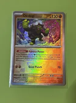 Pokemon TCG Okidogi Poke Ball Pattern Holo 057/131 Sv: Prismatic Evolutions - Image 1