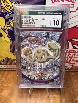 CGC Pristine 10 1999 Pokemon Topps Geodude Series 1 2nd Print #74 - Image 1