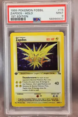 1999 Pokemon Zapdos Holo, 1st Edition Fossil #15/62, PSA 9 Mint - Image 1