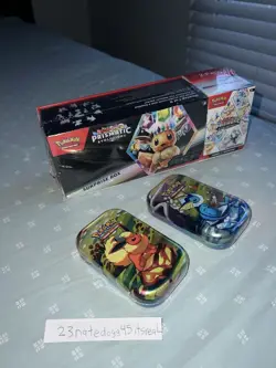 Pokemon Prismatic Evolutions Surprise Box Booster Bundle Sam’s Club 2 mini tins - Image 1