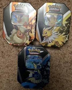 Pokemon TCG Jolteon V Flareon V Vaporeon V Tins Set Of 3 Eeveelutions Sealed 820650829055 - Image 1