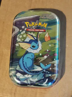 Pokemon TCG: Scarlet & Violet—Prismatic Evolutions Mini Tin – Vaporeon - New - Image 1