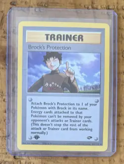 Pokemon TCG Trainer Brock’s Protection Non-Holo 1st Edition Vintage - Image 1