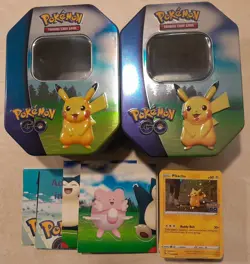 2 Pokemon Go Tins with 80+ Cards, Stickers and Unused Pokemon TCG Live Codes - Image 1