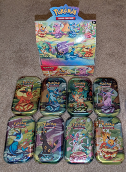 Pokemon Prismatic Evolutions 8 Sealed Mini Tins Complete Set - Image 1