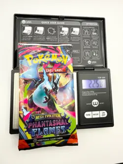 Phantasmal Flames Pokemon TCG Booster Pack – Sealed – 22.58g (Weight Shown) - Image 1