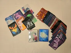Lot of Pokemon TCG 200+ Card Sleeves and 27 Card Dividers - Image 1