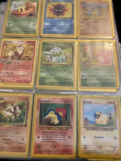 pokemon binder collection black yellow red and blue Pokemon with expensive cards - Image 2