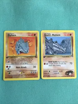 Pokemon Cards Rhyhorn 61/64 And Brock’s Rhyhorn 70/132 1st Edition Jungle - Image 1