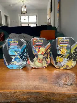 Pokemon TCG: Eevee Evolutions Tin (Set Of 3) Jolteon/Vaporeon/Flareon - Image 1