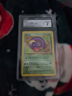 Pokemon TCG Fossil 1st Edition Ekans Card 46/62 CGC Graded 7 Free Shipping - Image 1