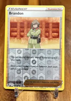 Brandon 151/195 Reverse Holo Silver Tempest Trainer Pokemon Card NM - Image 1