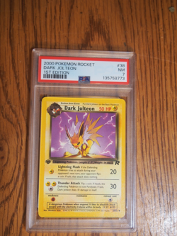 Pokemon 2000 1st Edition Team Rocket Dark Jolteon card, PSA 7 - Image 1