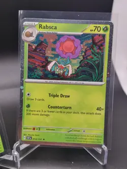Rabsca 2024 Pokemon TCG #014/191 SV8 Surging Sparks Rare Cosmos Holo - Image 3