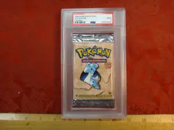 1999 Pokemon Fossil 1st Edition Lapras Unopened Card Pack PSA Graded Mint 9 - Image 1