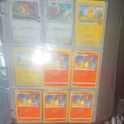 Pokemon TCG Mixed Card Lot Binder Pikachu Charizard Eevee Holo - Image 1