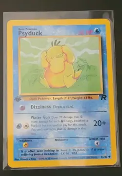 1st Edition Psyduck 65/82 - Team Rocket - Near Mint - Image 1