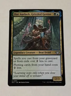 MTG Doc Aurlock, Grizzled Genius - Outlaws Of Thunder Junction LP - Image 1