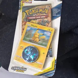 Pokemon Sun & Moon Unbroken Bonds Booster Pack Pikachu Promo Card & Coin - Image 1