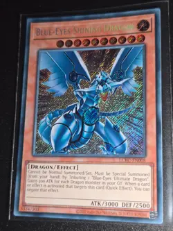 YUGIOH Secret Rare Blue-Eyes Shining Dragon LCKC-EN008 - Image 1
