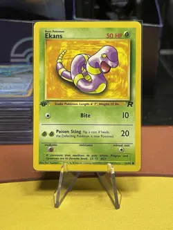 Pokemon Ekans 56/82 Team Rocket Common 1st Edition 2000 WOTC NM - Image 1