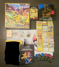 Pokemon Mixed Lot (Cards, Game Mat, Book, NIB Board Game, NIB Battle Deck, Box) - Image 1