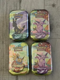 Lot of 4 - Pokemon TCG - Prismatic Evolutions Mini Tins - FACTORY SEALED - Image 1