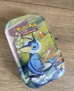 Pokemon TCG: Scarlet & Violet—Prismatic Evolutions Mini Tin – Vaporeon - New - Image 1