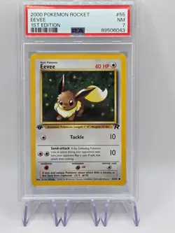 POKEMON Trading Card 2000 TEAM ROCKET 55/82 EEVEE 1st EDITION grade slab PSA 7 - Image 1