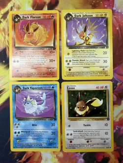 Eevee, Dark Vaporeon, Dark Jolteon & Dark Flareon Team Rocket 1999 Pokemon TCG - Image 1