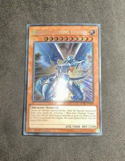 Yugioh Blue-Eyes Shining Dragon 1st Edition LCKC-EN008 Secret Rare - Image 1