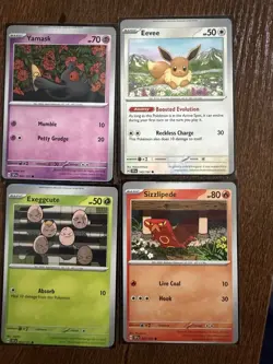 Lot Of 4 Miscut Error Pokemon cards Surging Sparks Eevee Yamask Exeggcute - Image 1