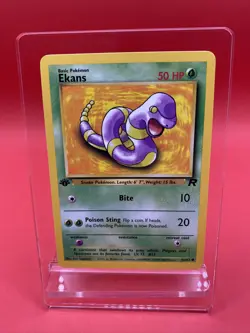 1st Edition Ekans 56/82 Team Rocket Pokemon Card Vintage WoTC NM - Image 1