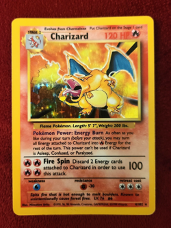 Charizard 004/102 Pokemon Card Base Set Unlimited Holo; moderately played - Image 1
